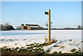 Fingerpost in the snow at Greenfield