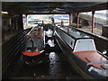 Two narrowboats in a graving dock