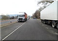 SO4911 : Lorries and cars parked alongside the A40 SW of Monmouth by Jaggery