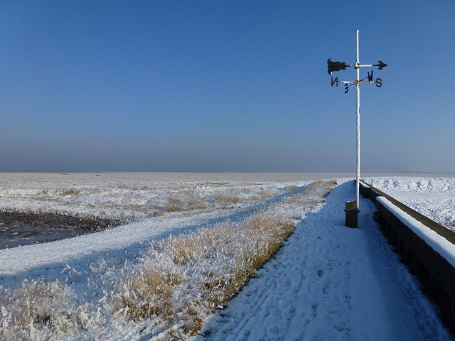 The Wash coast in winter - Weather vane on Lawyer's Creek outfall