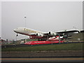 TQ0776 : The plane at the entrance to Heathrow Airport by Ian S