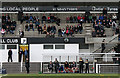 Spectators and officials at a Gala Fairydean football match