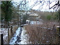 Footbridge across the Afon Alun / River Alyn below Bryn y Castell