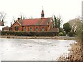 Frozen pond and the Church of The Brotherhood of The Cross and Star, Milespit Hill, NW7