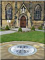 Compass sculpture in church grounds