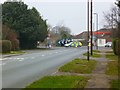 Looking north on Bell Lane to the roundabout at the end of the A286