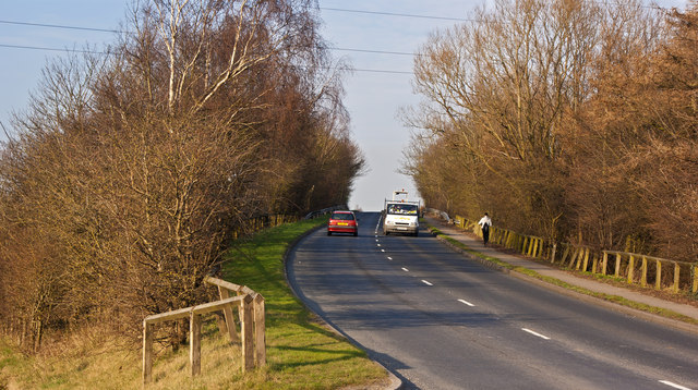 Whitefield Road climbs towards a bridge over the M62