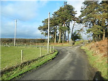 ST0593 : A bend in the road, and the entrance to the track to Glog by John Lord