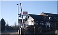 Ash Station and level crossing barrier