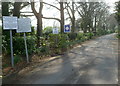 Four notices at the SE entrance to St Cadoc