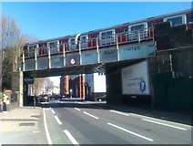 TQ2476 : District Line train passing over New King's Road by David Martin