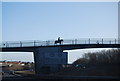 Horse rider crossing a bridge over the A27