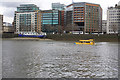 Buildings on the Albert embankments with a passing DUKW