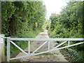 Metal barrier across a footpath into Cwmynyscoy Local Nature Reserve, Pontypool