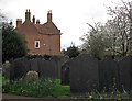 Wilford: rectory gables and slate headstones