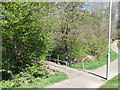 Paths and footbridge over Hollington Stream