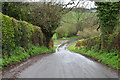 Looking down steep hill to the sign for Hollington