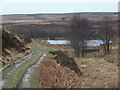 SK2776 : Track approaching small reservoir on Big Moor by Andrew Hill
