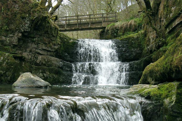 Waterfall and footbridge on the river Sychryd