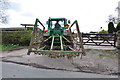 Tractor and Grass Harrows entering the Homestead Farm