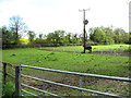 Paddocks with electricity transformer east of All Saints church