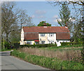 Cottages by sharp bend in Hall Road, Hundon