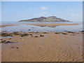 Refllection of Holy Isle in the sand