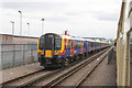 Charter train passes stabled electric multiple units