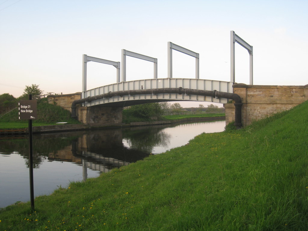 Download wallpaper 1600x900 bridge, pilings, river, hills widescreen 16:9 hd bac