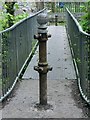 Disused turnstile posts on Lower Clydach River footbridge