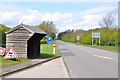 The B5061 {Old A5} with bus stop and Shelter