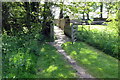 Footbridge on path to cottages