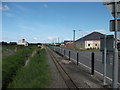 Miniature railway track heading towards the sea