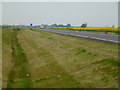 TF2206 : Roadside ditch and the new A16 near Newborough by Richard Humphrey
