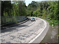 Car on the hairpin bend at Glen Bridge