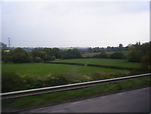 SP6560 : Farmland east of Flore seen from the M1 northbound by Colin Pyle
