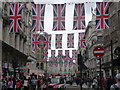 TQ2980 : London: Union flags over Coventry Street by Chris Downer