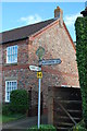 Signpost at the junction of Main Street, Shirbutt Lane & New Road, Hessay