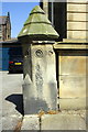 Benchmark on gatepost by Carnegie Library