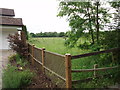 Looking beyond the last house on the Ridgeway towards Well Wood