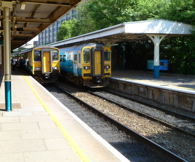 Two southbound trains waiting at Cardiff Queen Street railway station
