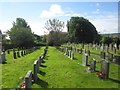 NU1034 : St Mary's parish church graveyard by Graham Robson