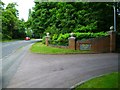 Hawley Road looking northwest from the entrance to Hawley Lodge