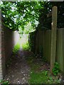 Footpath goes west from the A24 at The Vale