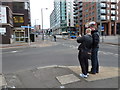 Pedestrians at the junction of Queen and Tenter Streets