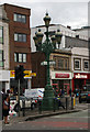 TQ2771 : Lamp standard and direction signs, Tooting Broadway by Jim Osley
