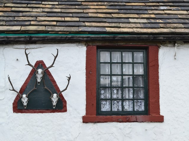 "Three Stags' Heads" pub sign and window