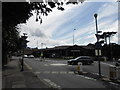 Looking from Hayes Street across the mini roundabout towards a BMW garage