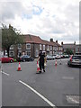 Armed policeman on cone duty