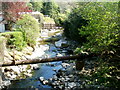 Pipeline and a wooden bridge across the Afon Lwyd